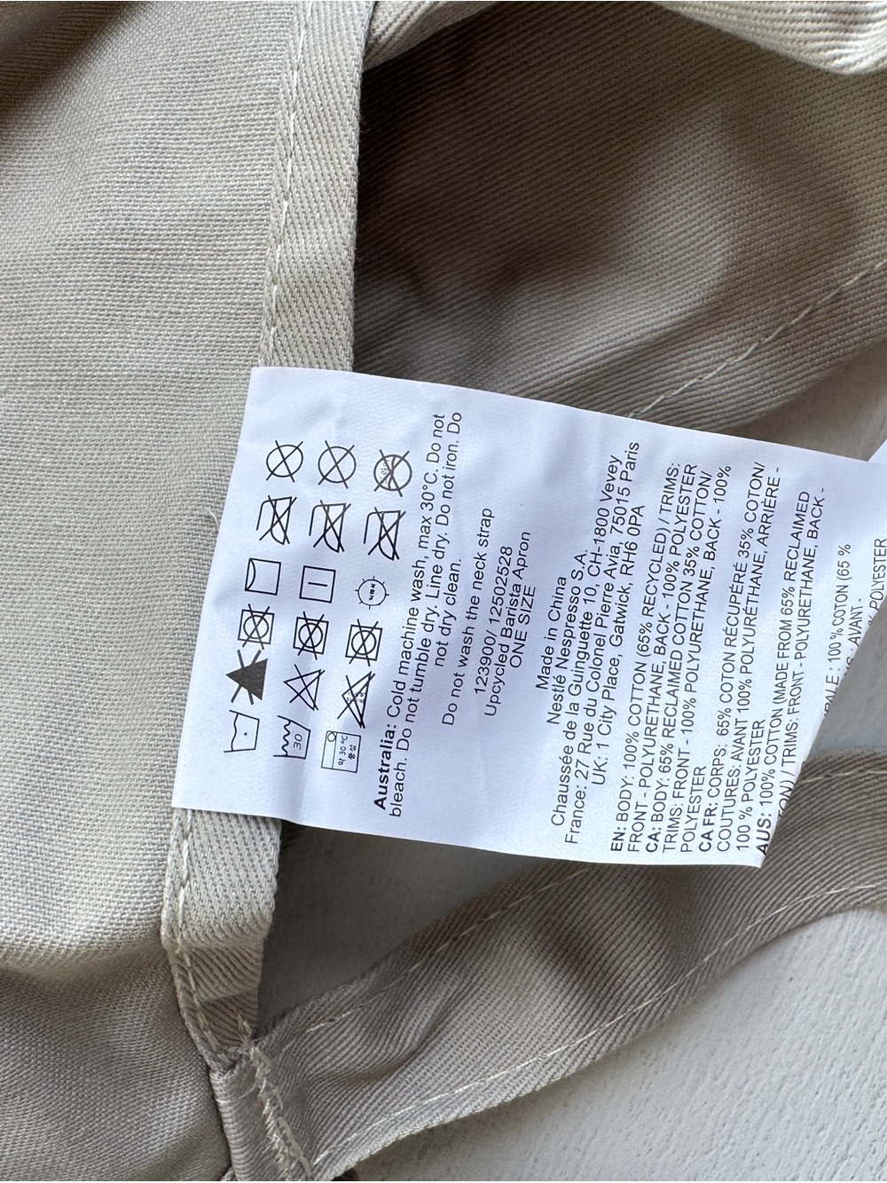 Nespresso apron in neutral beige with Brown Leather Finishes - Picture 4 of 4